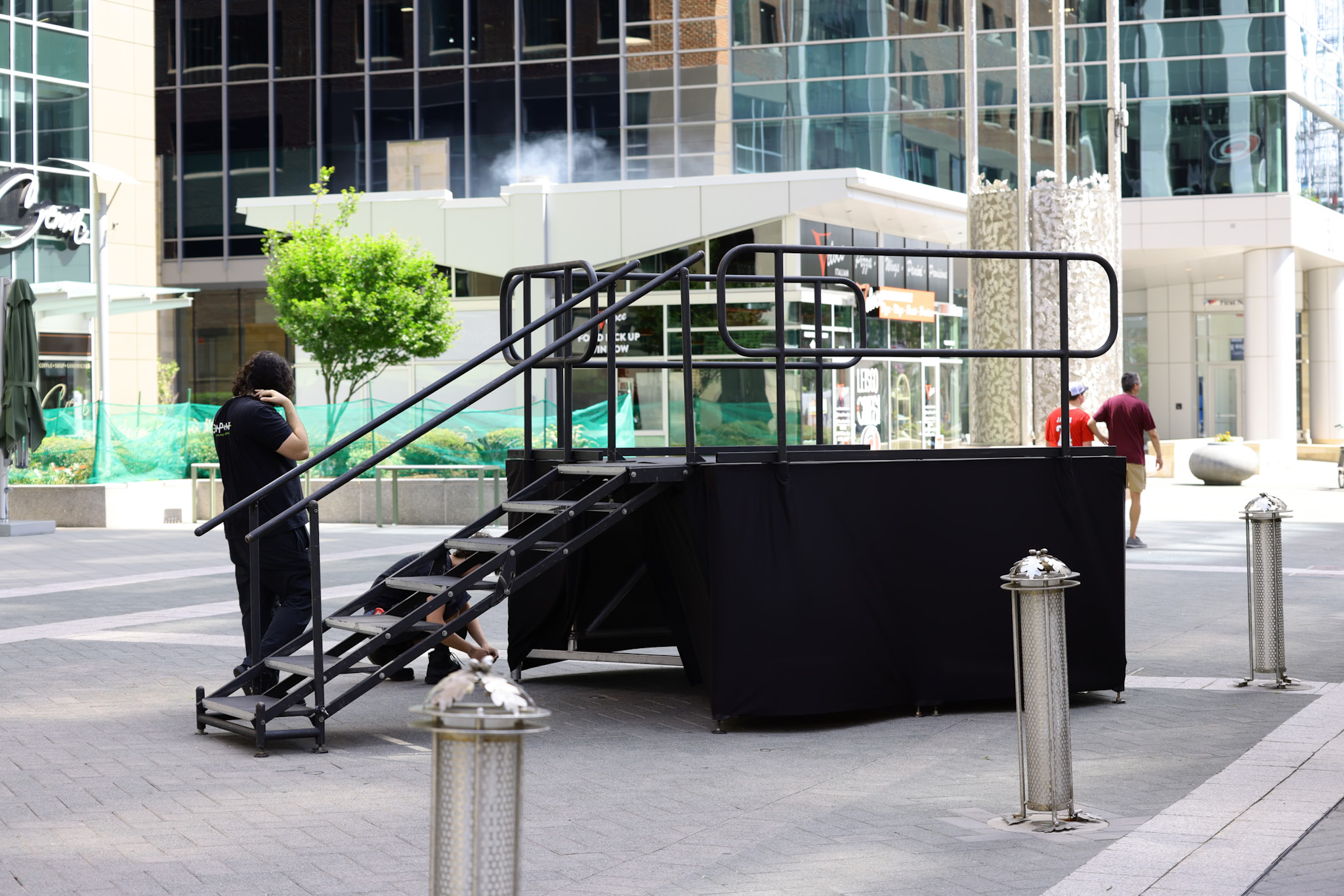 Downtown corporate stage setup at dusk