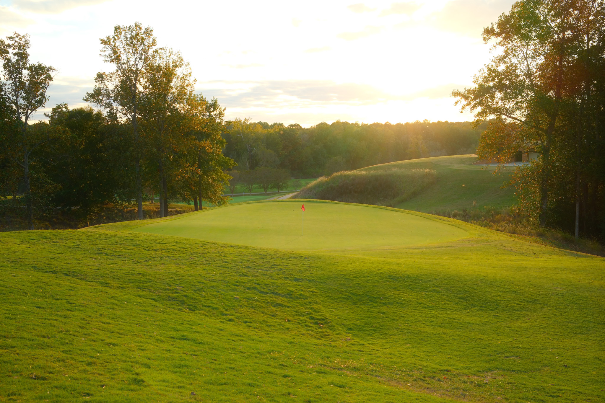 Golf green at golden hour — visibility, positioning, precision